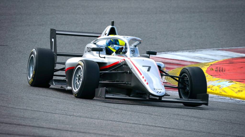 The F4 car shows visible similarities to the F1 Academy car