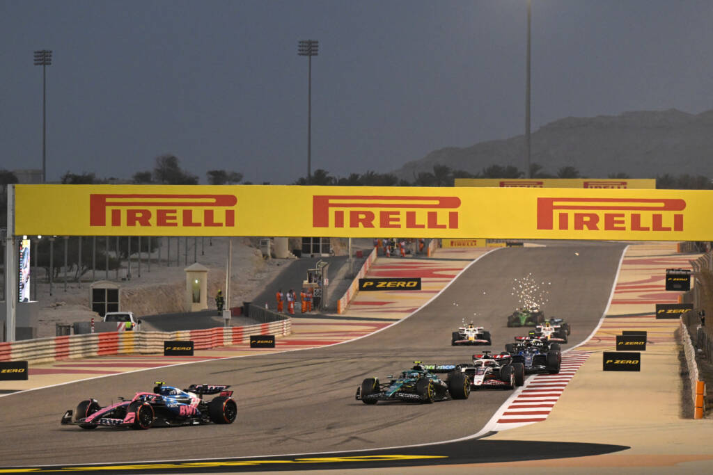 F1 cars at Bahrain during a dusk session