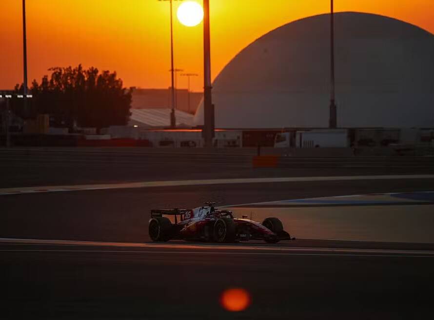 Charles Leclerc driving Ferrari during F1 Bahrain Testing 2026 at sunset