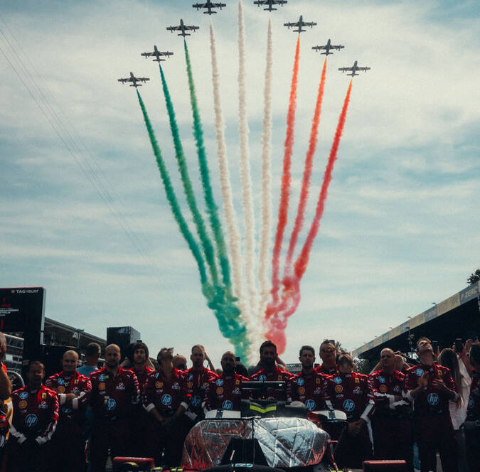 Ferrari Formula One team with Frecce Tricolori flyover at an Italian Grand Prix event